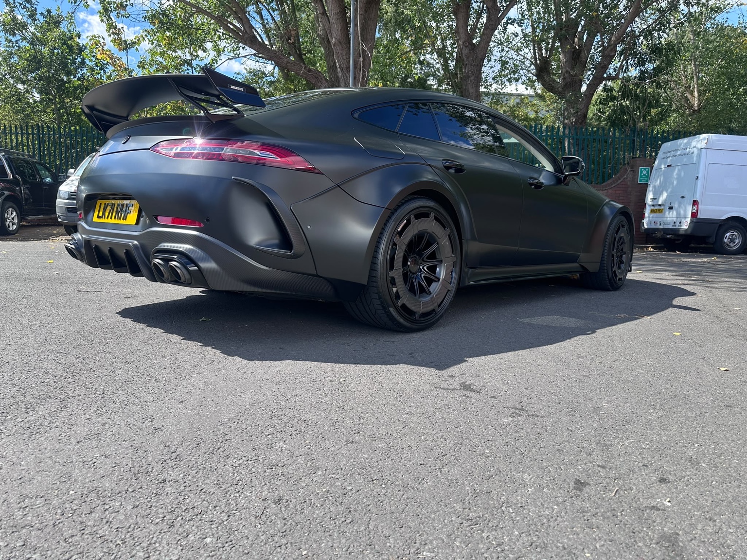 Matte black AMG GT rear three-quarter view